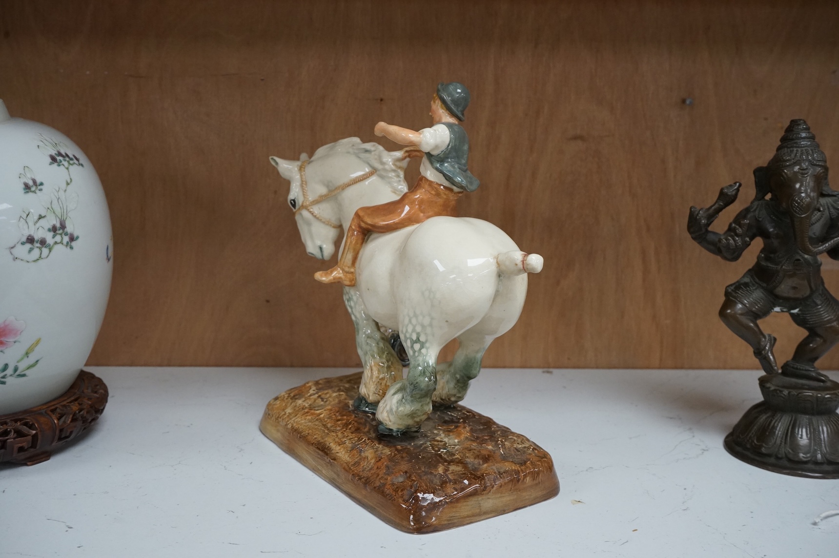 A Royal Doulton figure, ‘The Farmer's Boy’, HN 2520, 24cm wide.